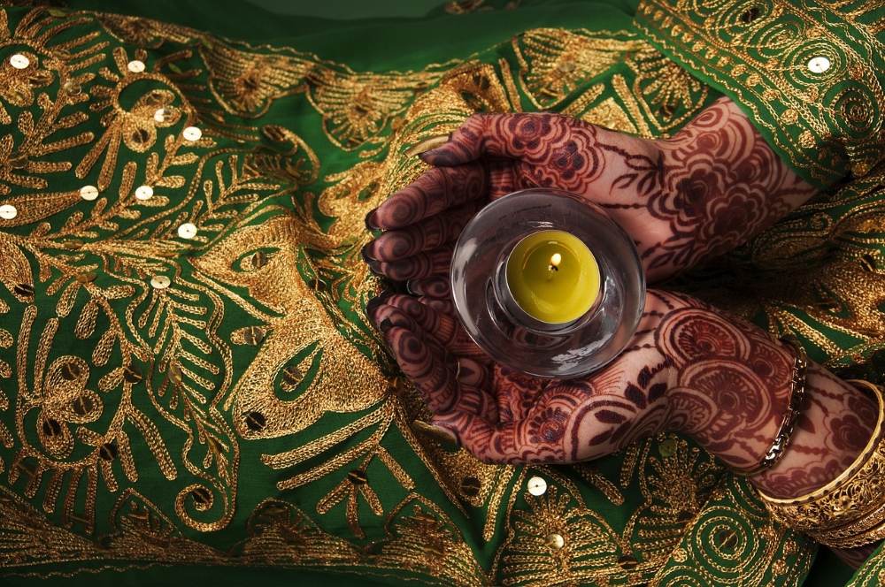 gorgeous fabric on a woman with henna on her hands